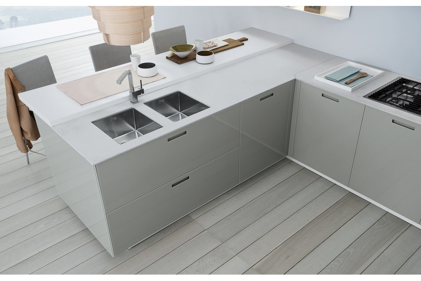 Features etched glass benchtops and doors in glass with beautiful cut-out handle detailing.
