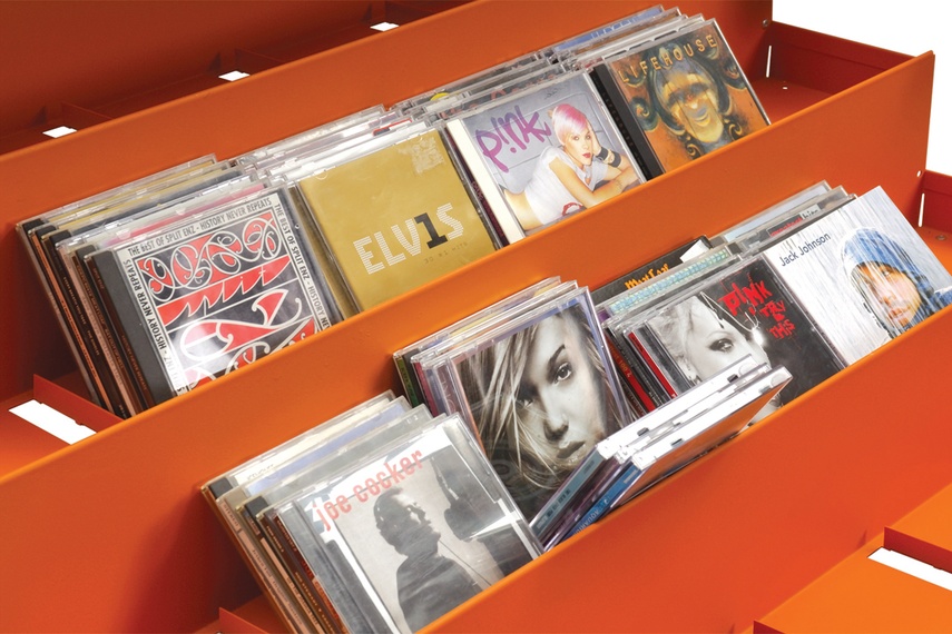 An angled shelf unit for the display spine out of CDs or DVDs