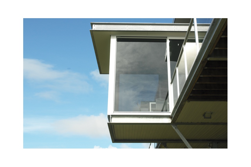 Floor-to-ceiling windows add drama to cantilevered rooms