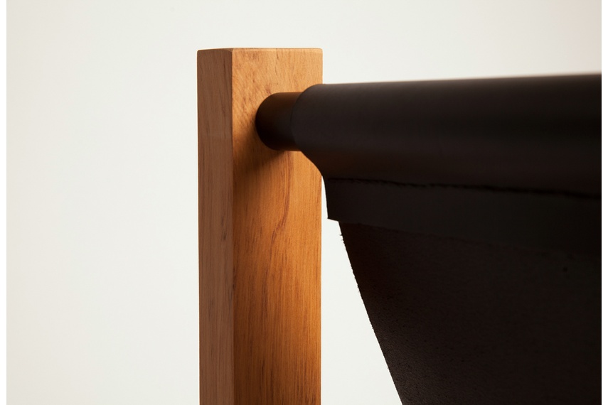 Each piece features a hand stitched leather hide seating element and flush pin joints through the head-rest and legs.