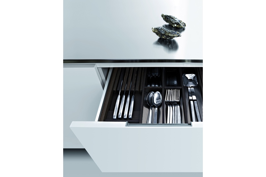 The kitchen features storage solutions that can be customised with the addition of exclusive accessories.